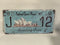 Vintage Style Tin Number Plate Sign<br><b style="color: #03236a;">JBAU844</b><br><b style="color: #03236a;">Opera House</b>